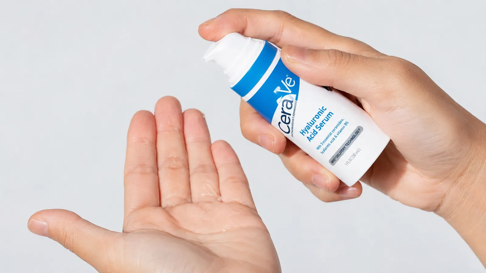 CeraVe Hyaluronic Acid Serum bottle held over a palm showing small water droplets